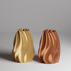 Two gold and bronze color 3d printed vases on a gray background