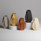 Set of five vases in different colors on a gray background