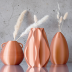 Three wooden vases with wicker accents on a wooden surface against a light gray background
