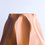 Close-up of a 3d printe sculpture against a light blue background