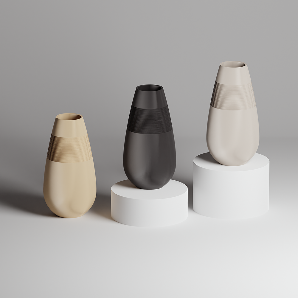 Three vases of different colors on cylindrical stands against a gray background