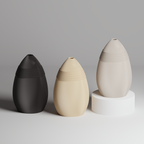 Three 3d print vases in black, beige, and white on a gray background