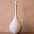 Beige vase on a light gray background