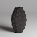 Black geometric vase on a gray background