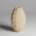 Beige geometric vase on a gray background