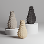 Three geometrically designed vases in gray, beige, and black on a gray background