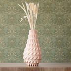Geometric vase with dried plants on a light blue background