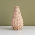 Geometric wooden vase on a light blue background