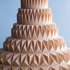 Multilevel design vase with geometric pattern on a light blue background