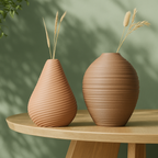 Two 3d print vases with ribbed texture on a wooden table against a green background